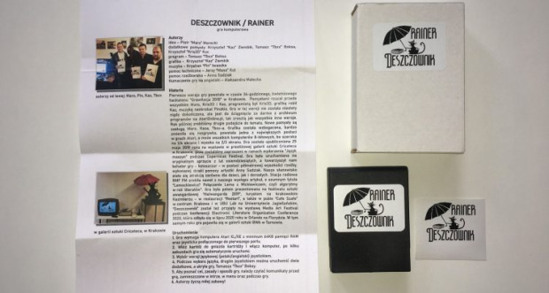 Photograph of "Deszczownik" materials: a project write-up with photos, game cartridge and packaging.