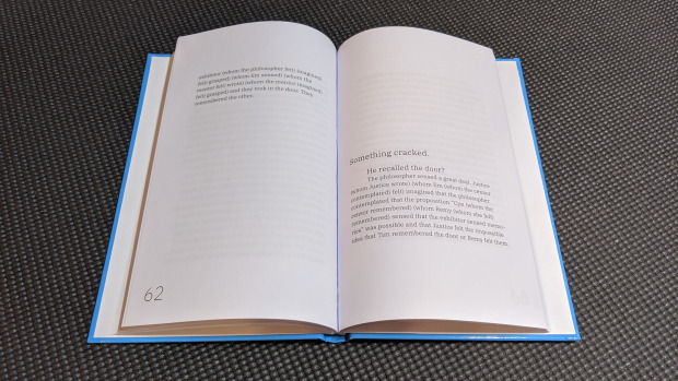 An open casebound book, inside covers rimmed in blue, showing pp. 62-63.