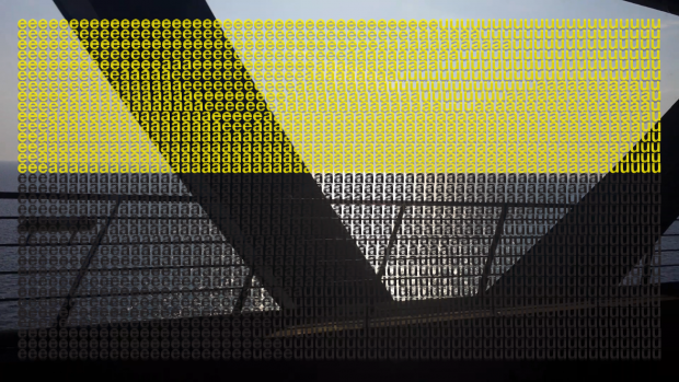 A bridge with a truss, overlaid with yellow and black letters