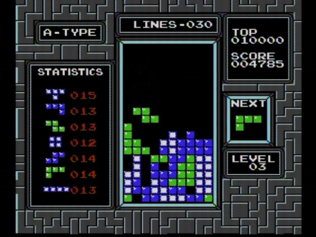 Tetris game interface with a game in play: the game is centred, with two info panels on either side.