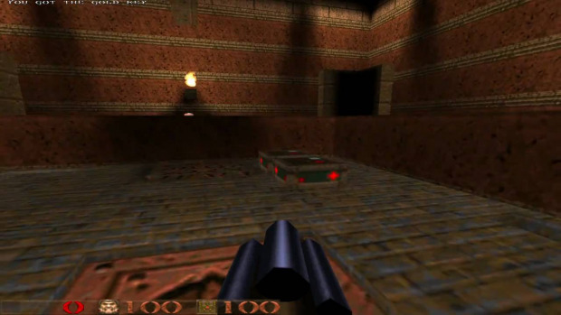 Screenshot of play: first person perspective, player holds gun, looking at deserted tomb level.