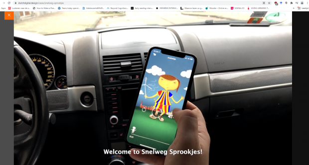 Screenshot of Promotional Video: App being loaded on a smartphone within a car.